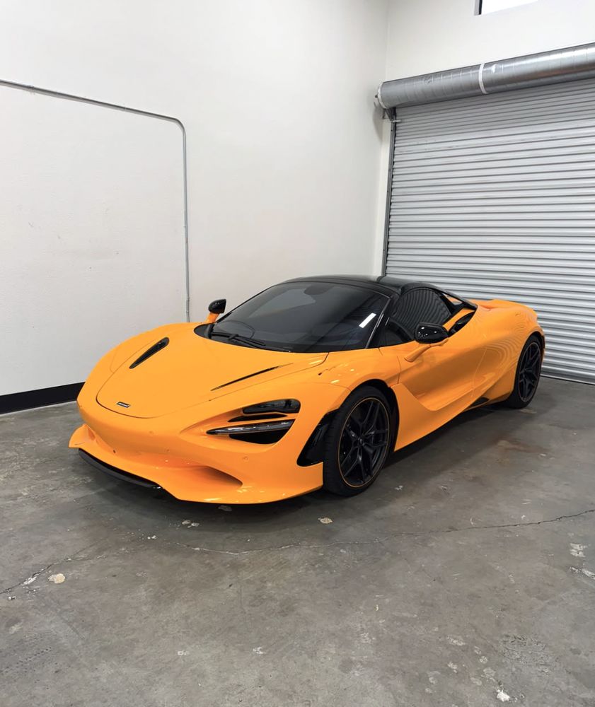 Orange McLaren 720S in the Executive Auto Solutions shop