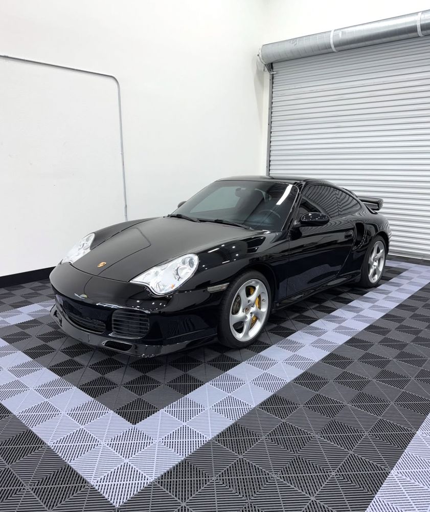 Gloss black Porsche 911 Turbo in the shop